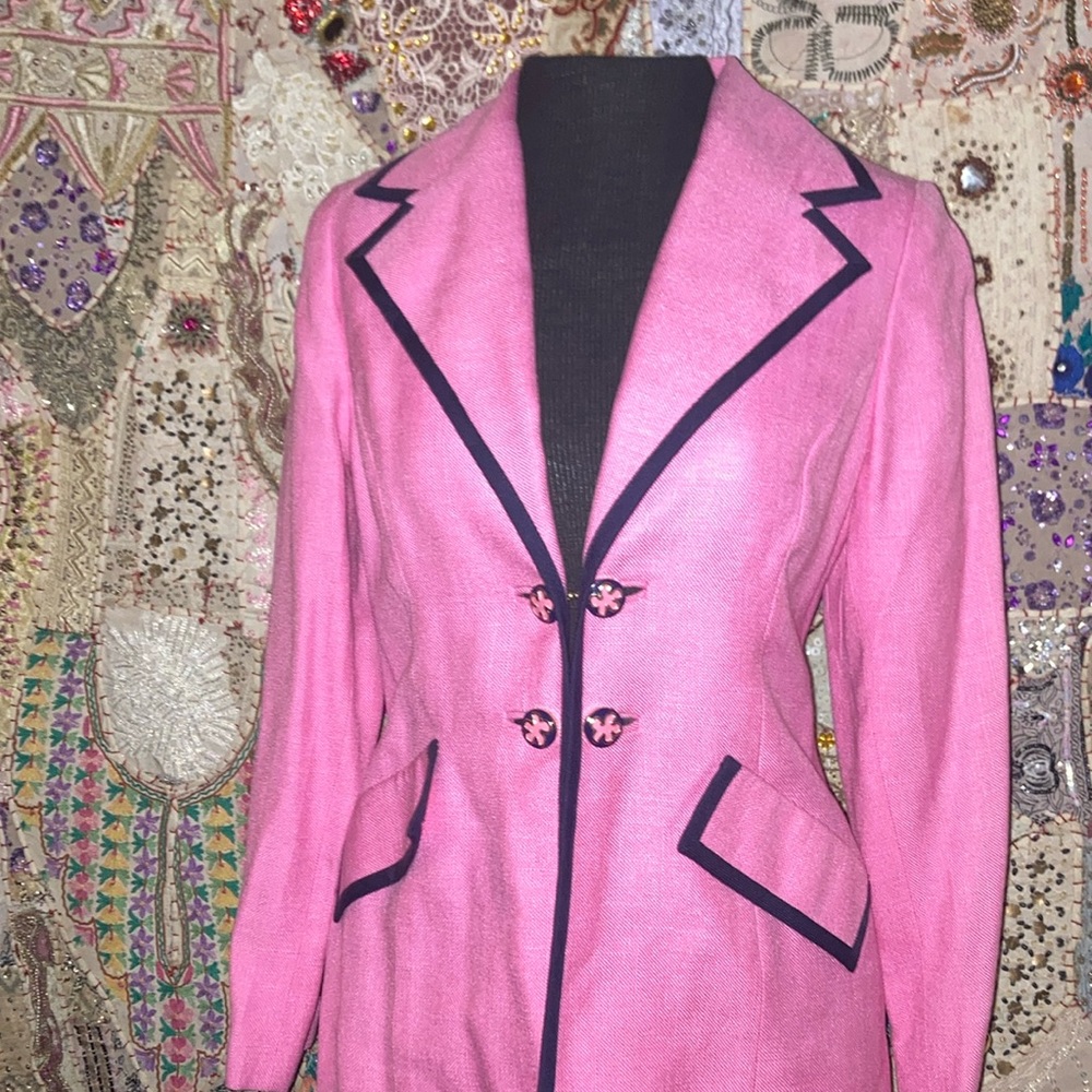 Classic gold chain attached closure of double breasted designer buttons